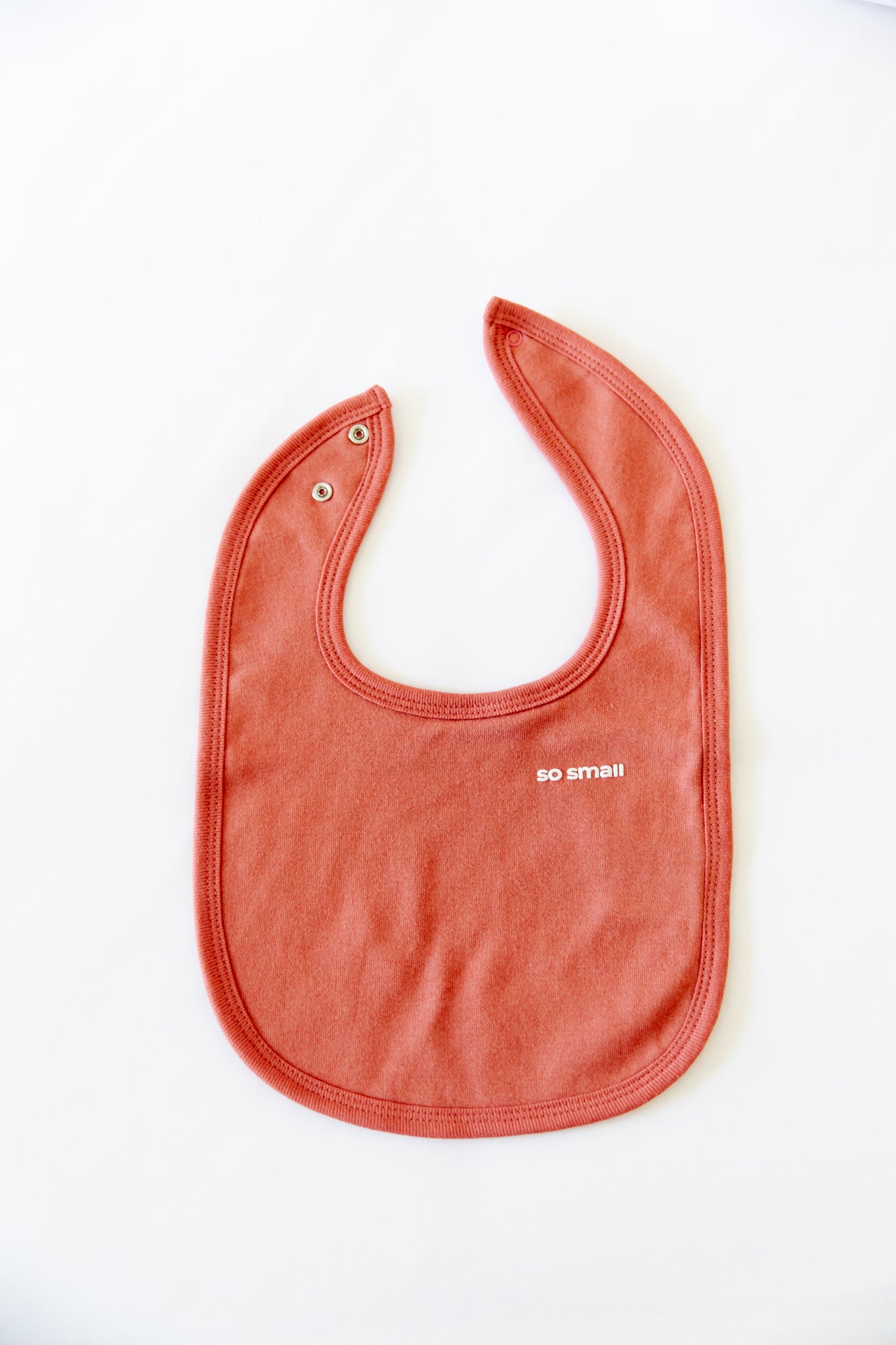 so small Organic Terry-Lined Bib- Holly Berry